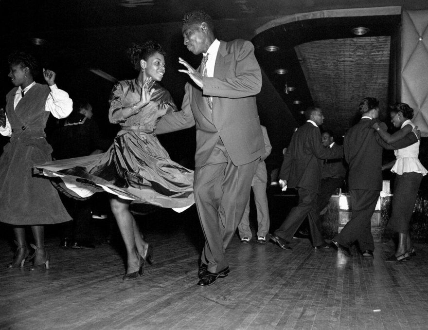 Two patrons dance to the music in the second-floor lounge at McCollum Hall.