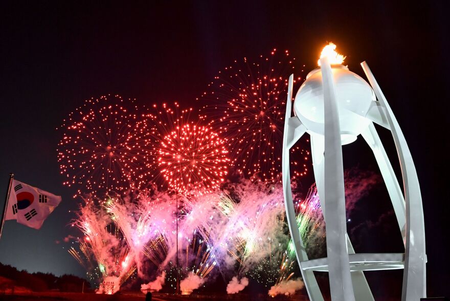 Fireworks light up the night sky outside the closing ceremony.