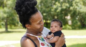 Venessa Aiken holds her son Jahzir Robinson, 5 weeks old, outside their home Sunday, Aug. 21, 2022, in Orlando. States around the country are making it easier for newborn moms to keep Medicaid in the year after childbirth, a crucial time when depression and other health problems can develop.