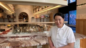 Chef Sky Kim in front of the raw bar at Gift Horse in downtown Providence.