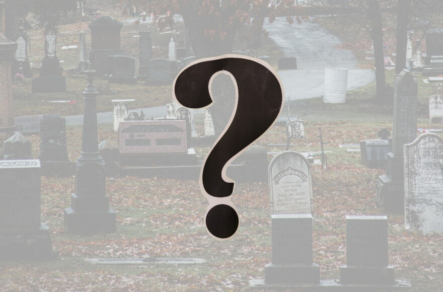 Cemetery with a question mark in the foreground