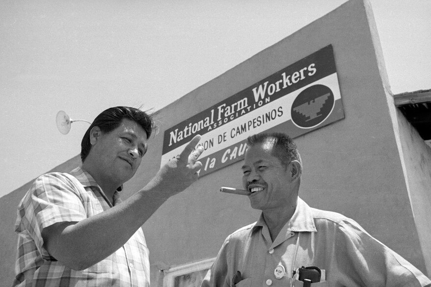 United Farm Workers leader Cesar Chavez, left, who led the fight as head of the AFL-CIO union local, talks with Larry Itliong, leader of the Filipino Agriculture Workers Organizing Committee, in front of union headquarters at Delano, Calif., July 28, 1967.