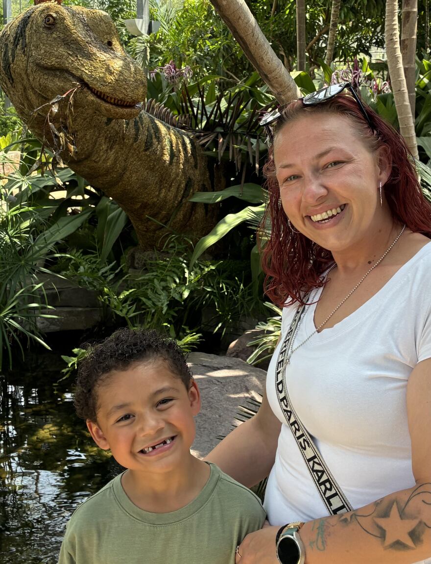 Nicole Govan and her nephew hunt for dinosaurs at Nicholas Conservatory during the "Dinosaurs of the Forgotten Forest" exhibit. They found an Apatosaurus, a plant-eater. There are nine dinosaurs and mammals to find. The exhibit runs through Oct. 19.