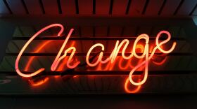 In neon lights, the sign reads "change"