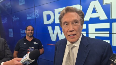 Perry Johnson speaks with reporters after a Republican gubernatorial primary debate on July 9, 2026.