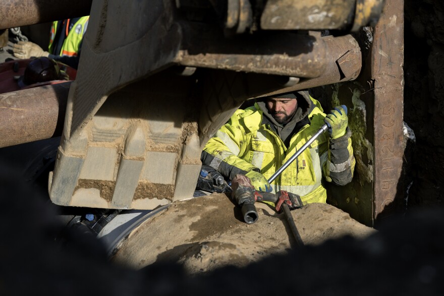FILE: Work continues on Thomaston Ave in Waterbury on December 15, 2025 to repair a water main that burst over the weekend leaving thousands without water.