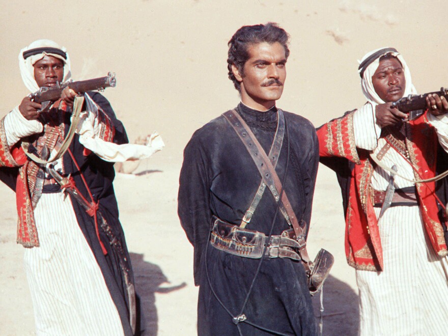 Dark and handsome, with a strong accent, Sharif — seen here in 1962's <em>Lawrence of Arabia</em> — didn't look like the movie stars audiences were used to.