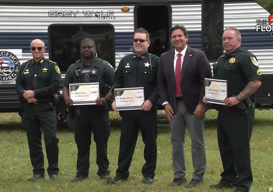 Governor Ron DeSantis announces a partnership to provide $5,000 grants to first responders impacted by Hurricane Isaias. The first eight grants went to deputies in Escambia and Santa Rosa counties.