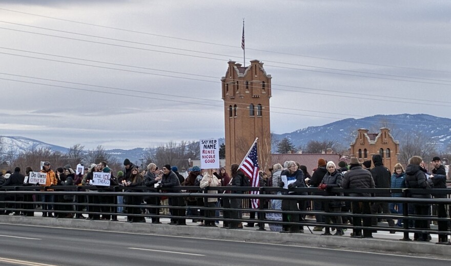 People gather on Beartracks Bridge in Missoula during a January 11, 2026 candlelight vigil for Renee Good, who was shot and killed by an ICE agent earlier in the week.
