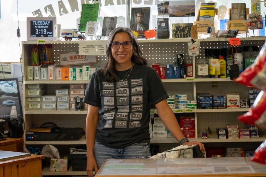 Heather Sudweeks stands behind the counter of her general store in Circleville, June 30, 2026. Residents in the small town have donated money so that firefighters can buy groceries.