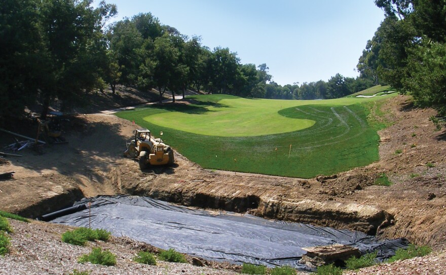 A bio-filtration basin, pictured during installation in 2007, captures water runoff from the Pelican Hill golf club's maintenance facility. The water is filtered through grass, gravel, sand, soil and filter fabric into an underground drainage system.