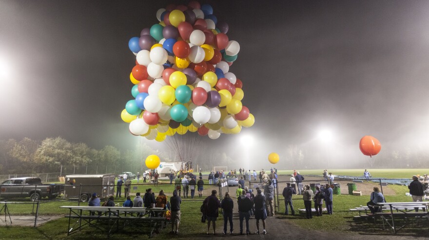 <strong>Party On: </strong>Legislation passed last week allows the Federal Helium Reserve to continue selling the stockpiled gas. Above, Jonathan Trappe launches his 370-balloon craft from Caribou, Maine, in an attempt to cross the Atlantic Ocean on Sept. 12.