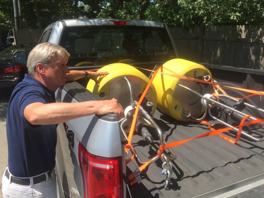 Massachusetts Division of Marine Fisheries shark scientist Greg Skomal shows off the real-time acoustic receivers he planned to deploy Tuesday afternoon. The receivers detect the presence of tagged white sharks.