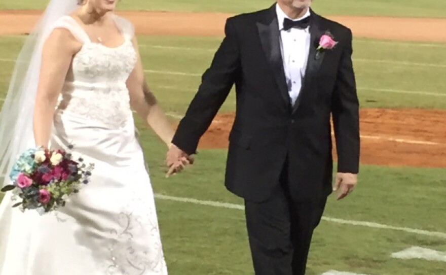 Mr. and Mrs. Mark Cain got a free wedding at Columbia's new minor league baseball park, thanks to a class of University of South Carolina students.