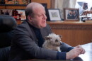 Gov. Jared Polis and his dog, Gia, in the governor's office at the Colorado Capitol.
