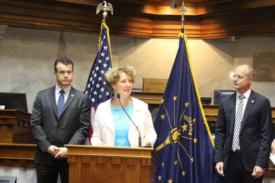 U.S. Rep. Susan Brooks (R-Carmel) speaks to media. U.S. Sen. Todd Young (R-Ind.), left, and FCC Commissioner Brendan Carr, right, applaud Indiana's leadership on 5G technology.