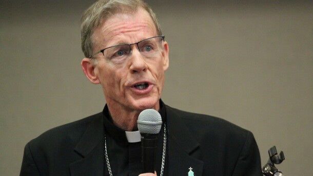 FILE - Archbishop John C. Wester, head of the Archdiocese of Santa Fe, N.M., talks to reporters on Nov. 29, 2018, in Santa Fe. A federal bankruptcy judge has approved a $121 million reorganization plan for one of the oldest Roman Catholic dioceses in the U.S. as it tries to stem financial losses from clergy abuse claims that date back decades. The Archdiocese of Santa Fe announced the outcome Thursday, Dec. 29, 2022. In a statement, Wester said he hopes the agreement will bring a measure of justice and relief to victims. (AP Photo/Susan Montoya Bryan, File)