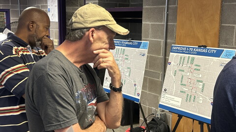 A man looks over a map of I-70.
