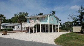 Larry and Donna Pipers’ house on Tybee Island now stands 11 feet above the ground, hopefully high enough to keep it out of future floods. (Emily Jones/WABE)