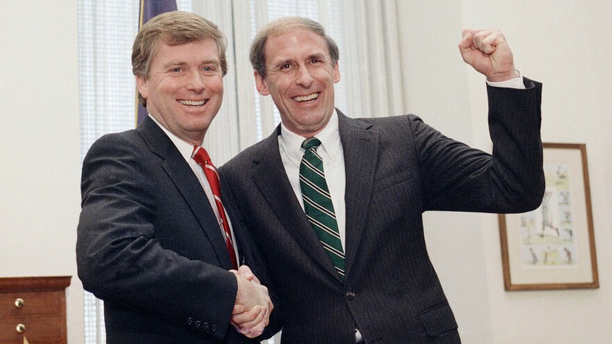 Newly sworn-in Sen. Dan Coats, right, shakes hands with Vice President-elect Dan Quayle in 1989 after Coats took the Senate oath. Coats was chosen to succeed Quayle as senator.
