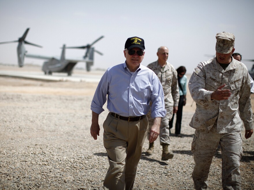 Then U.S. Secretary of Defense Robert Gates walks from an Osprey aircraft after landing at Forward Operating Base Dwyer on June 5, 2011 in Kandahar province, Afghanistan.