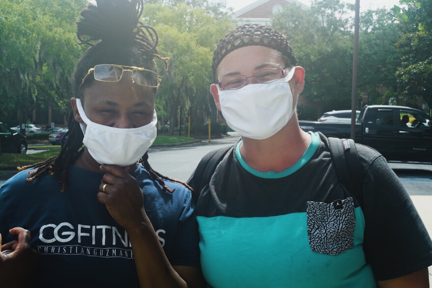 Jeonna (left) and Stacy (right) Shazel wear the new fabric face masks they picked up from the LeRoy Collins Library.