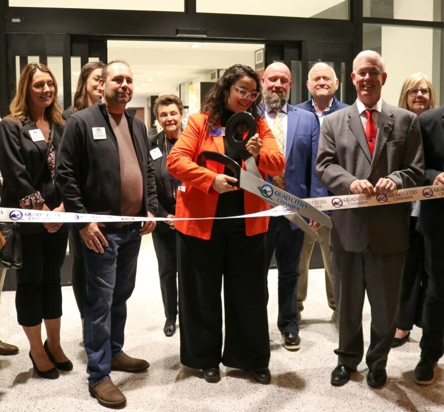 Kelly Lao cut the ribbon for the Putnam Museum and Science Center's new Quad City Innovators gallery in April 2024 on the second floor.