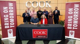 Cook Group President Pete Yonkman and Indiana University President Pamela S. Whitten sign a five-year Master Collaboration Agreement between IU and Cook Medical during an event at the Cook Medical headquarters in Bloomington on Friday, Aug. 29, 2025.