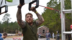 Competitor Travis Pierce tackles the steel rig part of the course on Saturday in Waldo. (Reagan Knight/WUFT News)