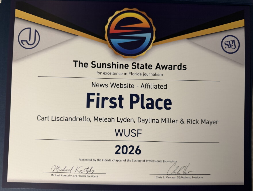 A photo of a first place certificate from the Society of Professional Journalists Sunshine State Awards. 
