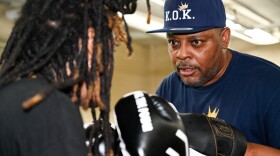 Rob Bell spars with a Knock Out Kings boxer at the East Bluff Community Center.