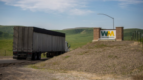 A truck drives through the entrance of the WM-Kettleman Hills Hazardous Waste Facility outside of Kettleman City on Jan. 13, 2026.