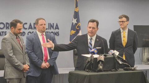 N.C. State Board of Elections executive director Sam Hayes, center, held a news conference Thursday about the start of mail-in absentee voting.