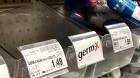 The hand sanitizer bin at Fred Meyer in Midtown Anchorage sits empty on March 4, 2020. The store was sold out of sanitizer, as were many stores in Anchorage, over concerns about the coronavirus. (Julia O'Malley/Alaska Public Media)