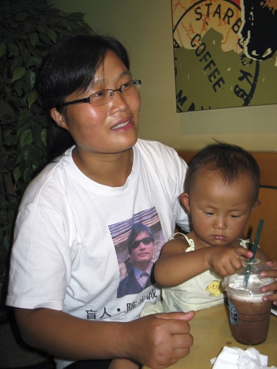 Yuan Weijing, the wife of activist Chen Guangcheng, is shown with the couple's daughter in a 2007 interview in Beijing. The girl, now 6, is followed to school every day by Chinese security agents, who always check her schoolbag, according to Chen.