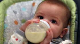A nine month old baby girl at meal time. Photo Tim Clayton (Photo by Tim Clayton/Corbis via Getty Images)