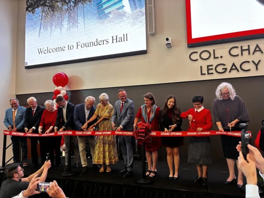 From left to right, Gary Joeris, Charlie Lutz, Sister Walter Maher, Ryan Yaden, Jack Lewis, Liza Lewis, President Thomas M. Evans, Suzanne Goudge, Monse Elizondo, Sister Leticia de Jesus Rodriguez and Eva M. Fernández, join in the ribbon cutting ceremony of UIW’s Founders Hall on Monday.