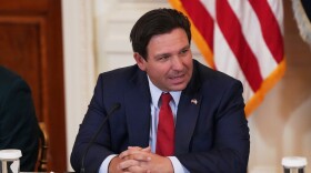 FILE - Florida Gov. Ron DeSantis is seen before a roundtable discussion on college sports in the East Room of the White House, Friday, March 6, 2026, in Washington.