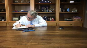 Gov. Mike DeWine signs Ohio's two-year state budget into law on July 18, 2019.
