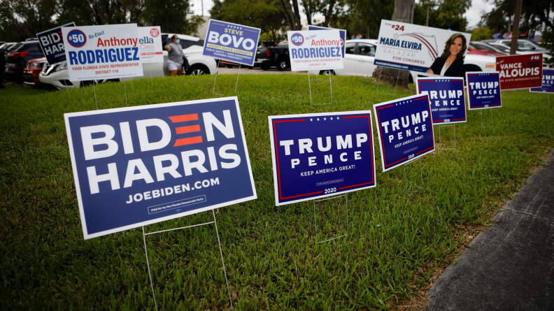 Campaign signs are in abundance last week for early voting at Westchester Regional Library in Miami.