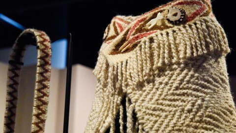 Details from Kelly Sullivan's shawl and small bag on display at Woven in Wool: Resilience in Coast Salish Weaving at the Burke Museum.