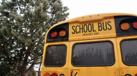 A school bus parks outside the New Mexico State Capitol in January 2023.