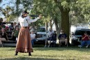 Alia Hunt aims her BB gun at a red balloon at the "Miss Annie Oakley" sharpshooting competition in Greenville.