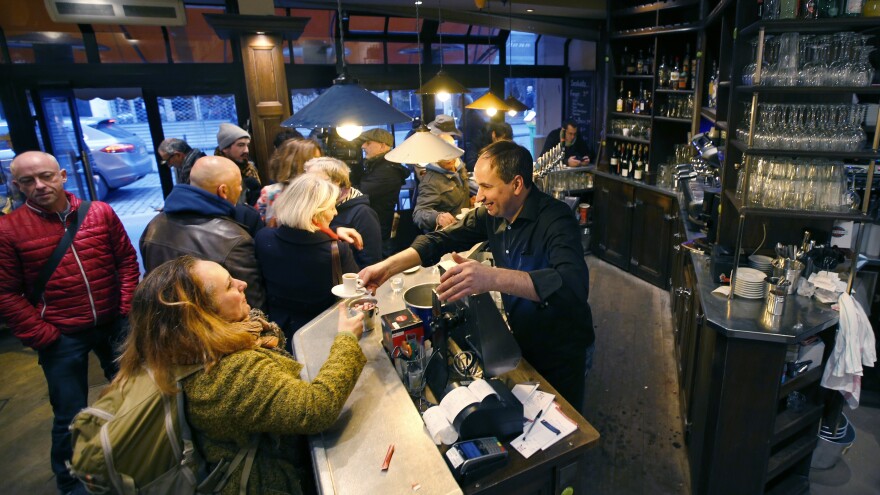 Customers turned out Friday at the Bonne Biere cafe, reportedly the first Paris cafe that was attacked to reopen.