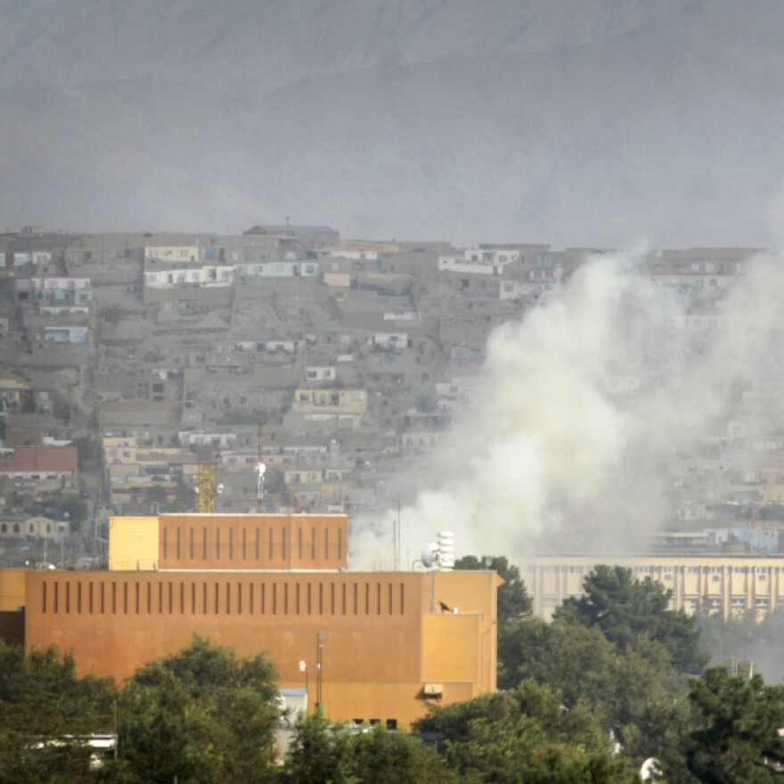 Dust rises after firing by Taliban militants in Kabul, Afghanistan, after Taliban insurgents fired rocket-propelled grenades and assault rifles at the U.S. Embassy earlier this month.