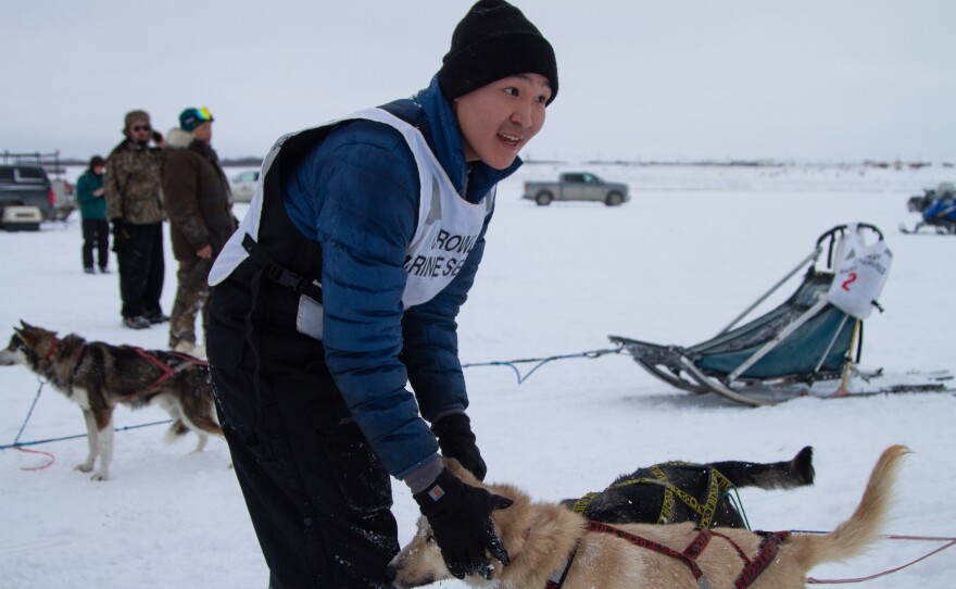 Jason Pavila pats his dogs after placing third.