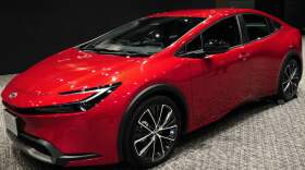 Toyota unveils a new Prius in Tokyo on Nov. 16, 2022. A quarter century after Toyota introduced the Toyota Prius, hybrids remain popular with shoppers.