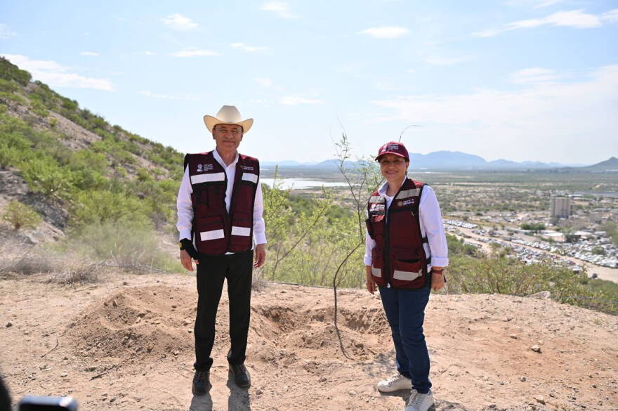Sonora Gov. Alfonso Durazo poses with a newly planted tree during a national reforestation event.