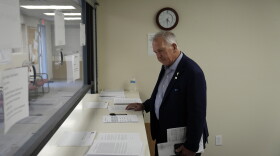 FILE - Interim Nye County Clerk Mark Kampf works in an office where early votes are being counted, Oct. 26, 2022, in Pahrump, Nev.