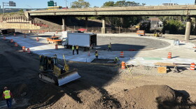 Crews work on the roundabout at Van Buren and Almond Streets, which takes traffic to ground level and the community grid once the viaduct comes down.